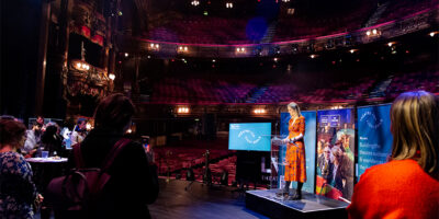 Co-CEO Claire Walker giving speech on London Palladium stage