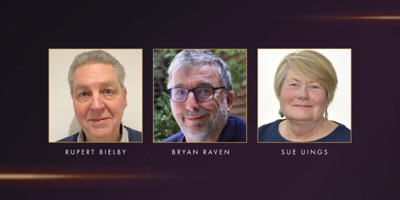 Three headshots in gold-bordered frames against a dark background. Below each photo, names are displayed: Rupert Bielby on the left, Bryan Raven in the centre, and Sue Uings on the right.