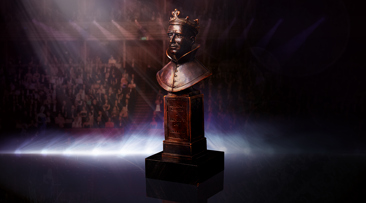 Photo of the Olivier Awards statuette under a spotlight