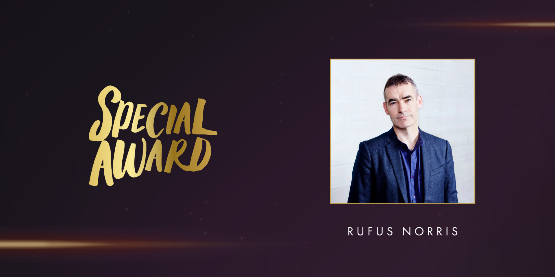 "Special Award" written in gold calligraphy on a dark background. To the right, a portrait of Rufus Norris in a navy suit and dark blue shirt, framed in gold. His name appears below in white text.